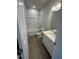 Bathroom features a shower and tub combination and a single sink vanity at 176 Bruce Dr, Dunn, NC 28334