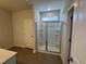 Bathroom featuring glass shower and neutral tile at 176 Bruce Dr, Dunn, NC 28334