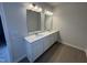 Bathroom features double vanity, tile floors, and neutral color palette at 176 Bruce Dr, Dunn, NC 28334