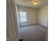 Cozy bedroom features neutral carpet, natural light and fresh paint at 176 Bruce Dr, Dunn, NC 28334