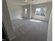 Bright, carpeted bedroom with two large windows for ample natural light at 176 Bruce Dr, Dunn, NC 28334
