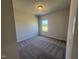 Bedroom with neutral walls and carpet and a single window for natural light at 176 Bruce Dr, Dunn, NC 28334
