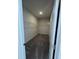 Walk-in closet with carpet, rod for hangers, and shelving at 176 Bruce Dr, Dunn, NC 28334