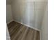 Walk-in closet has wood-look vinyl flooring and a wire shelf at 176 Bruce Dr, Dunn, NC 28334
