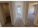 Upstairs hallway features access to a laundry room, bedroom, and window seat at 176 Bruce Dr, Dunn, NC 28334