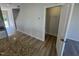 View from the kitchen shows entry, stairs, and closet with wire shelving at 176 Bruce Dr, Dunn, NC 28334