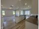 Open-concept living space with a kitchen island and a view into the living room at 176 Bruce Dr, Dunn, NC 28334