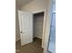 Pantry in bathroom featuring white wire shelving and a 5-panel door at 176 Bruce Dr, Dunn, NC 28334