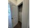 A shelved pantry with an arched, paneled door in the kitchen area at 176 Bruce Dr, Dunn, NC 28334