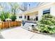 Charming back porch with outdoor seating, perfect for enjoying a morning coffee or evening breeze at 211 W Chisholm St, Sanford, NC 27330