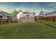 Expansive backyard with a well-maintained lawn and a deck, perfect for outdoor activities at 211 W Chisholm St, Sanford, NC 27330