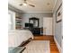 Bedroom featuring hardwood floors, shelves, and a window at 211 W Chisholm St, Sanford, NC 27330