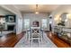Bright and airy dining room with hardwood floors, perfect for Gathering gatherings at 211 W Chisholm St, Sanford, NC 27330