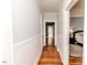Hallway with beadboard paneling leading to bedrooms at 211 W Chisholm St, Sanford, NC 27330