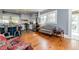 Eat-in kitchen featuring stainless appliances, granite countertops, and wood floors at 211 W Chisholm St, Sanford, NC 27330