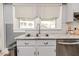 Kitchen with stainless appliances, granite countertop, and white tiled backsplash at 211 W Chisholm St, Sanford, NC 27330