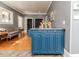 Kitchen with blue island, stainless countertop and appliances, and wood flooring at 211 W Chisholm St, Sanford, NC 27330