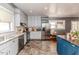 Eat-in kitchen with stainless appliances, granite countertops, and tiled backsplash at 211 W Chisholm St, Sanford, NC 27330
