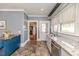 Galley kitchen with stainless appliances, granite countertops, and tiled backsplash at 211 W Chisholm St, Sanford, NC 27330