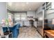 Eat-in kitchen with stainless appliances, granite countertops, and tiled backsplash at 211 W Chisholm St, Sanford, NC 27330