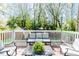Inviting outdoor deck features cozy seating, perfect for relaxing or entertaining guests at 211 W Chisholm St, Sanford, NC 27330