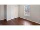 Bedroom features hardwood floors, closet, and a window letting in plenty of natural light at 227 Coley Farm Rd, Fuquay Varina, NC 27526