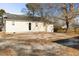 The exterior of a detached garage is on a lot surrounded by a wooden fence at 227 Coley Farm Rd, Fuquay Varina, NC 27526