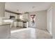 Kitchen featuring light tile floors, white cabinets and stainless steel appliances at 227 Coley Farm Rd, Fuquay Varina, NC 27526
