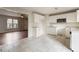 Kitchen with white cabinets, granite countertops, stainless microwave, and tile flooring at 227 Coley Farm Rd, Fuquay Varina, NC 27526
