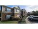 Attractive two-story building featuring brick and vinyl siding, enhanced by well-maintained landscaping at 2631 Oldgate Dr # 101, Raleigh, NC 27604