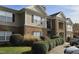 Inviting exterior of a brick and siding multi-Gathering home with manicured landscaping and a private balcony at 2631 Oldgate Dr # 101, Raleigh, NC 27604