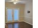 Comfortable living area with French doors, ceiling fan, and television mount at 2631 Oldgate Dr # 101, Raleigh, NC 27604