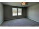 Comfortable bedroom features plush carpeting and large windows offering tranquil views at 279 Constellation Ct, Benson, NC 27504