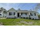 Charming single-story home featuring a covered front porch and professionally landscaped yard at 279 Constellation Ct, Benson, NC 27504