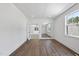 Bright bedroom with wood floors, large window, and doorway to the adjoining room at 2809 Theresa Eileen Way, Raleigh, NC 27603
