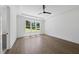 Bright bedroom with hardwood floors, ceiling fan and large windows with a lovely view at 2809 Theresa Eileen Way, Raleigh, NC 27603