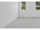 Well-lit bedroom featuring plush carpet and large windows with scenic views at 2809 Theresa Eileen Way, Raleigh, NC 27603