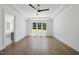Bright bedroom with hardwood floors, tray ceiling, ceiling fan and large windows with a lovely view at 2809 Theresa Eileen Way, Raleigh, NC 27603