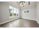 Bright bedroom features hardwood floors and large windows bringing in natural light at 2809 Theresa Eileen Way, Raleigh, NC 27603