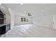 Spacious bonus room featuring a ceiling fan, bar, and built-in shelving at 2809 Theresa Eileen Way, Raleigh, NC 27603