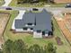 Newly built two-story home with a gray roof and manicured lawn, complemented by fresh landscaping at 2809 Theresa Eileen Way, Raleigh, NC 27603