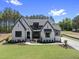 Beautifully landscaped, light colored, single Gathering home, with dark gray accents and a manicured lawn at 2809 Theresa Eileen Way, Raleigh, NC 27603