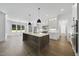 Bright, open kitchen featuring a large island, modern appliances, and sleek cabinetry at 2809 Theresa Eileen Way, Raleigh, NC 27603