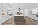 Spacious kitchen featuring a large island, ample cabinetry, and stainless steel appliances at 2809 Theresa Eileen Way, Raleigh, NC 27603