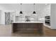 Bright, open kitchen featuring a large island, modern appliances, and sleek cabinetry at 2809 Theresa Eileen Way, Raleigh, NC 27603
