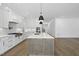 Bright, open kitchen featuring a large island, modern appliances, and sleek cabinetry at 2809 Theresa Eileen Way, Raleigh, NC 27603