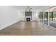 Bright living room with fireplace, ceiling fan and large sliding glass doors for indoor/outdoor living at 2809 Theresa Eileen Way, Raleigh, NC 27603