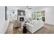 Cozy living room with a fireplace, built-in cabinets, and a sliding door to the sunroom at 2809 Theresa Eileen Way, Raleigh, NC 27603