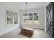 A bright and modern living room with hardwood floors and large windows overlooking a natural view at 2809 Theresa Eileen Way, Raleigh, NC 27603