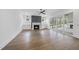 A bright living room with hardwood floors, a fireplace and cabinets and sliding glass doors to the back at 2809 Theresa Eileen Way, Raleigh, NC 27603